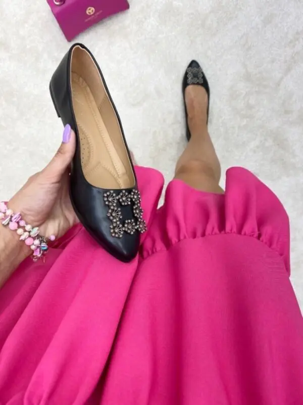 Balerinos su auksine detale